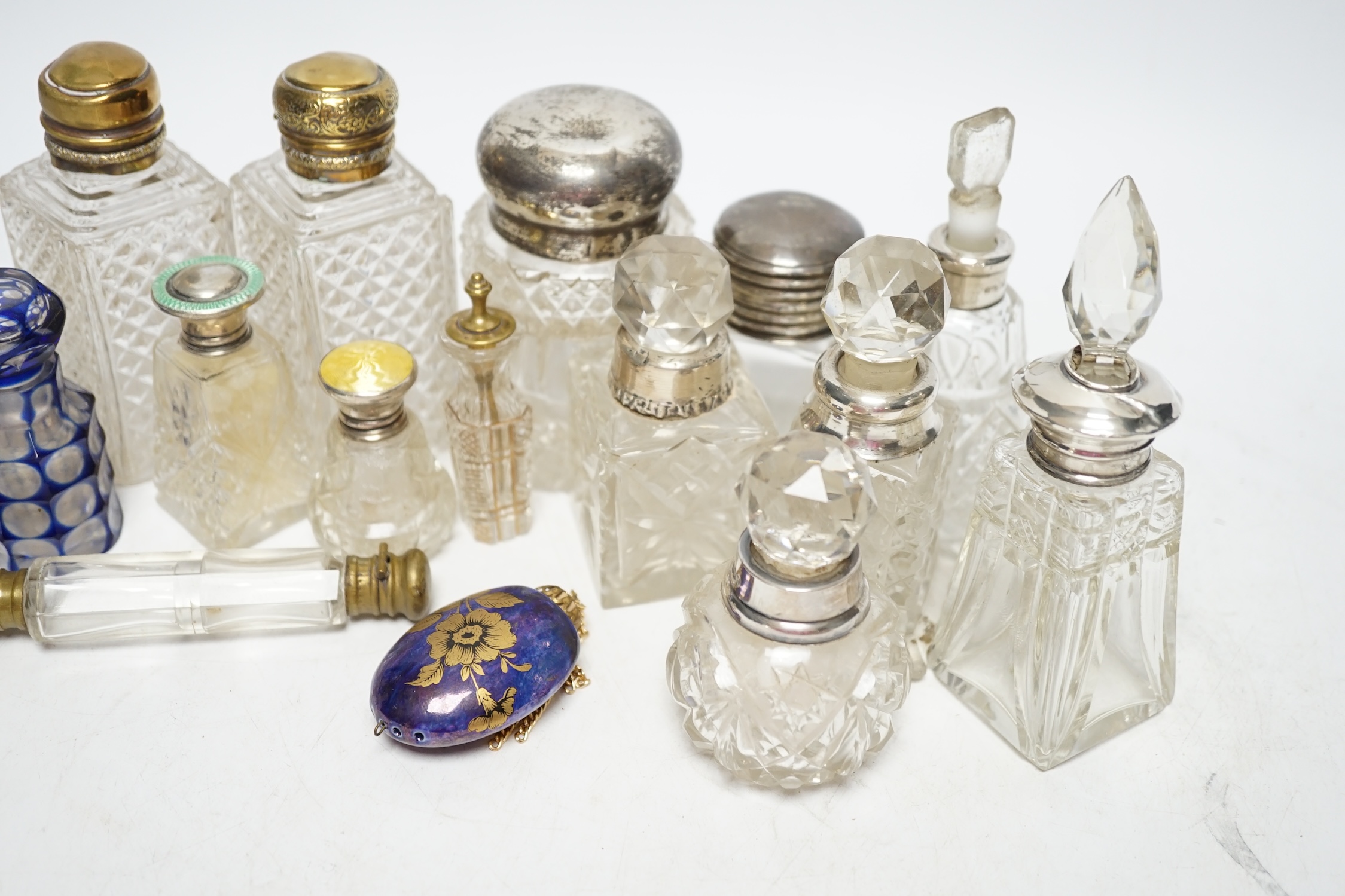 A collection of silver mounted and other perfume bottles